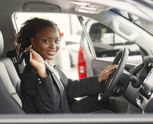 young female driver with keys